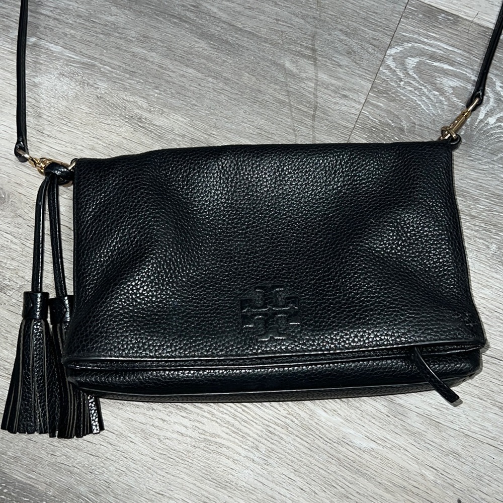 Black leather Tory Burch Thea fold over satchel.